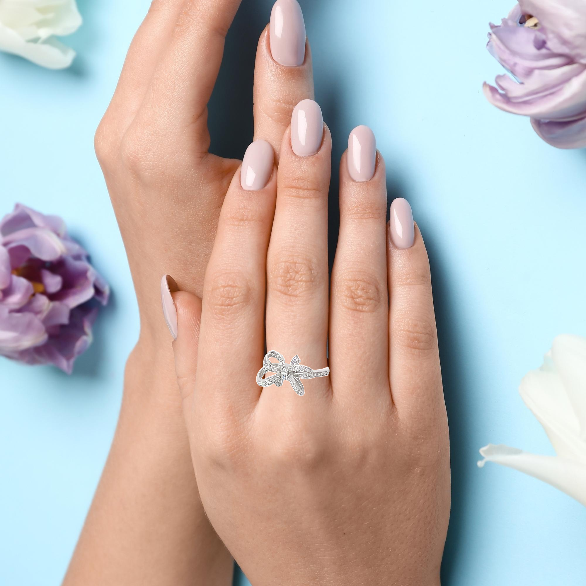 SPARKLING BOW TIE RING IN SILVER